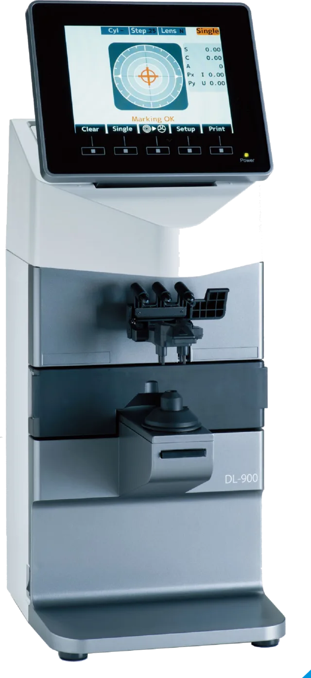 The auto lensmeter used here: a screen above, and a clamp that holds a pair of spectacles while it reads them.